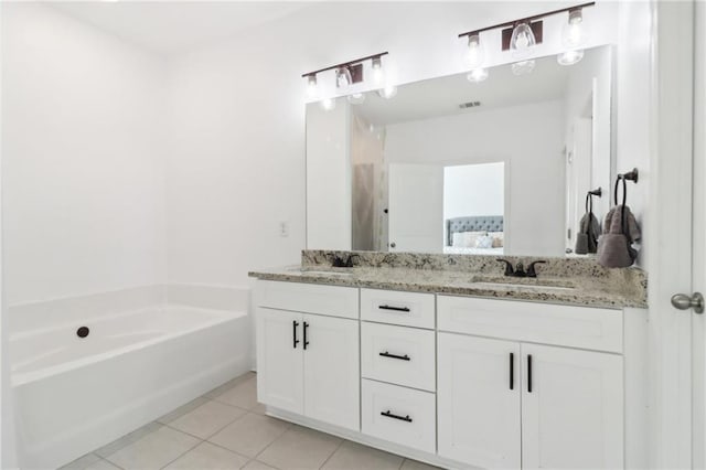 full bathroom featuring tile patterned flooring, a garden tub, a sink, and double vanity