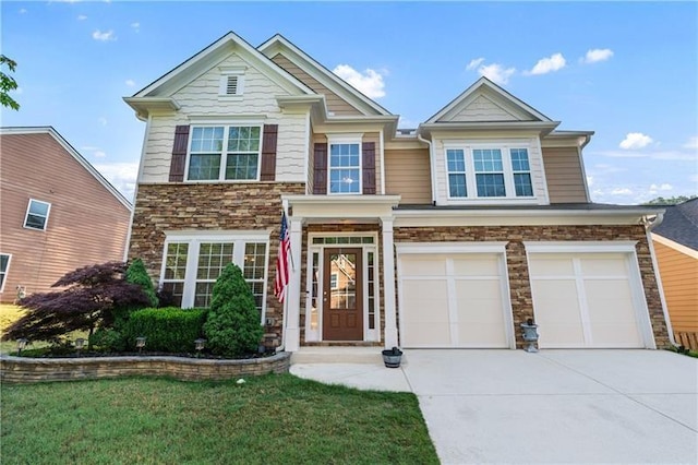 971 Reap Ln, Lawrenceville, GA 30043 - view of front of home with stone siding, driveway, and an attached garage