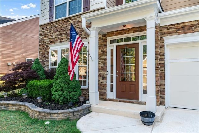 971 Reap Ln, Lawrenceville, GA 30043 - property entrance featuring stone siding and a garage