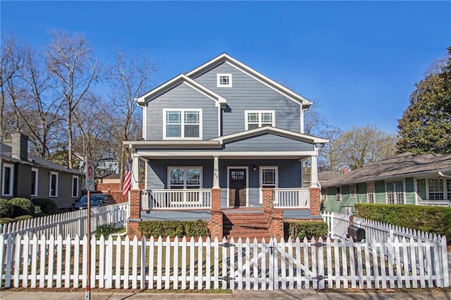 view of front facade featuring a fenced front yard and a porch