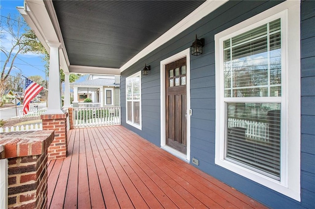 wooden deck featuring covered porch