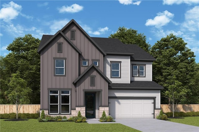 view of front facade with a front yard and a garage