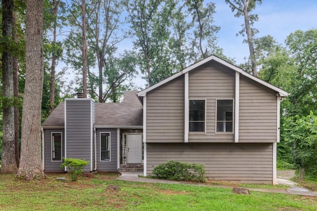 6249 Townsend Way, Riverdale, GA 30296 - view of front facade featuring a chimney and a front lawn
