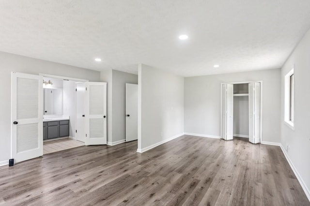 6249 Townsend Way, Riverdale, GA 30296 - unfurnished bedroom featuring wood finished floors, recessed lighting, a closet, and ensuite bath