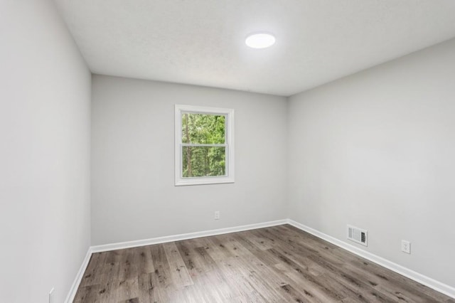 6249 Townsend Way, Riverdale, GA 30296 - spare room featuring wood finished floors and baseboards