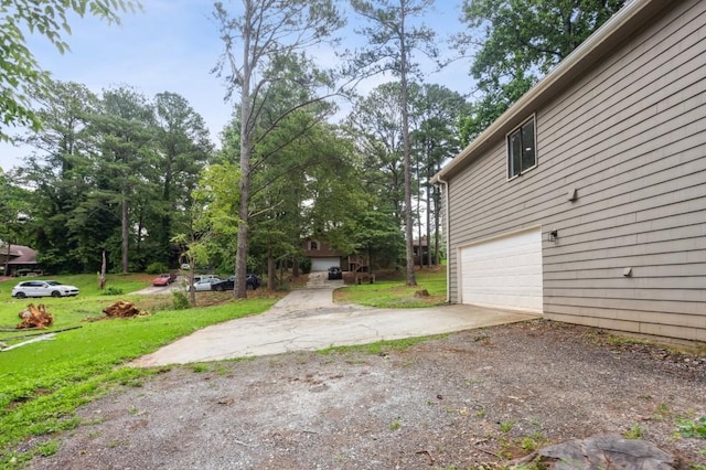 6249 Townsend Way, Riverdale, GA 30296 - view of green lawn featuring an attached garage and driveway