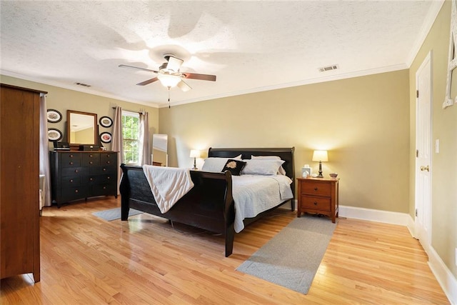 5020 Huntshire Ln SW, Lilburn, GA 30047 - bedroom featuring light wood-type flooring, a textured ceiling, ceiling fan, and ornamental molding