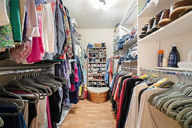 5020 Huntshire Ln SW, Lilburn, GA 30047 - spacious closet featuring wood finished floors