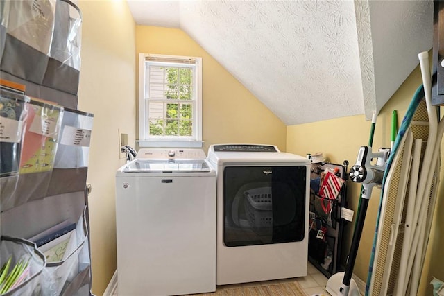 5020 Huntshire Ln SW, Lilburn, GA 30047 - laundry room featuring separate washer and dryer and a textured ceiling
