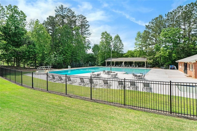 5020 Huntshire Ln SW, Lilburn, GA 30047 - community pool with a patio and view of wooded area