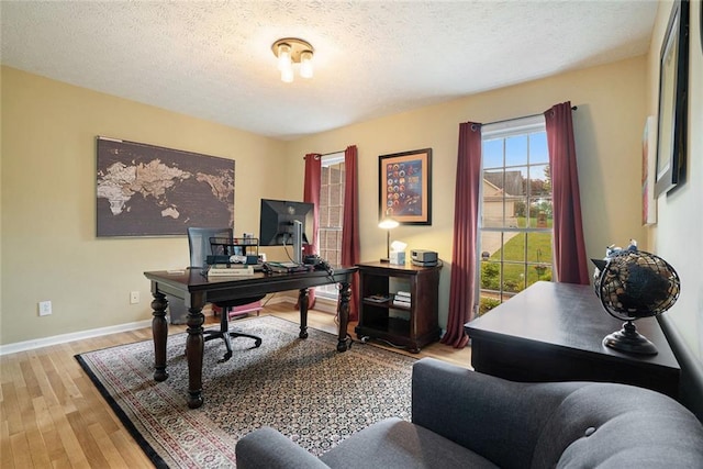 5020 Huntshire Ln SW, Lilburn, GA 30047 - office with wood finished floors and a textured ceiling