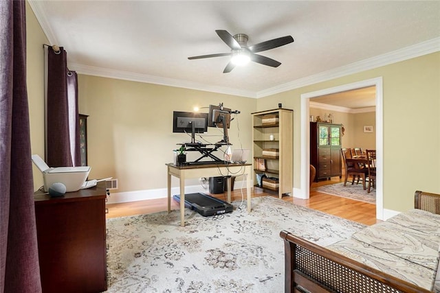 5020 Huntshire Ln SW, Lilburn, GA 30047 - living area featuring wood finished floors, ornamental molding, a ceiling fan, and an office area
