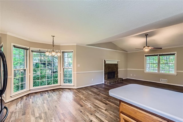 62 Sweetwater Pkwy, Powder Springs, GA 30127 - unfurnished living room with dark wood-style flooring, baseboards, a ceiling fan, ornamental molding, and a chandelier