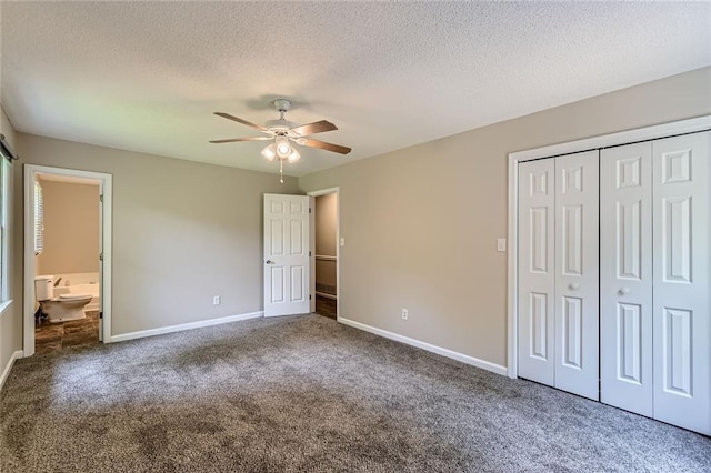 62 Sweetwater Pkwy, Powder Springs, GA 30127 - unfurnished bedroom featuring carpet, a closet, baseboards, a textured ceiling, and a ceiling fan