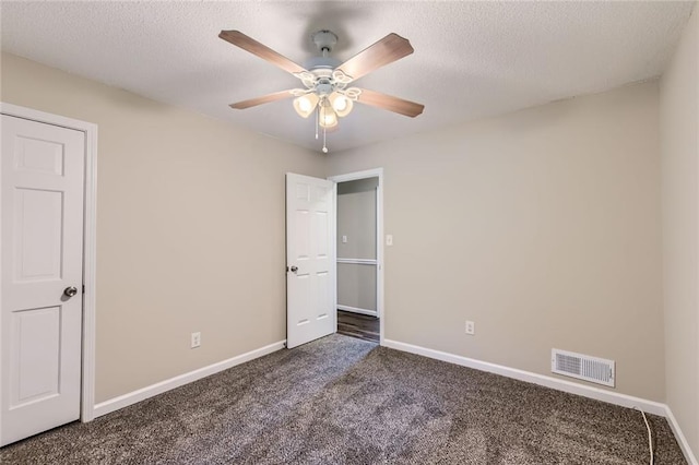 62 Sweetwater Pkwy, Powder Springs, GA 30127 - unfurnished bedroom with carpet floors, baseboards, a ceiling fan, and a textured ceiling