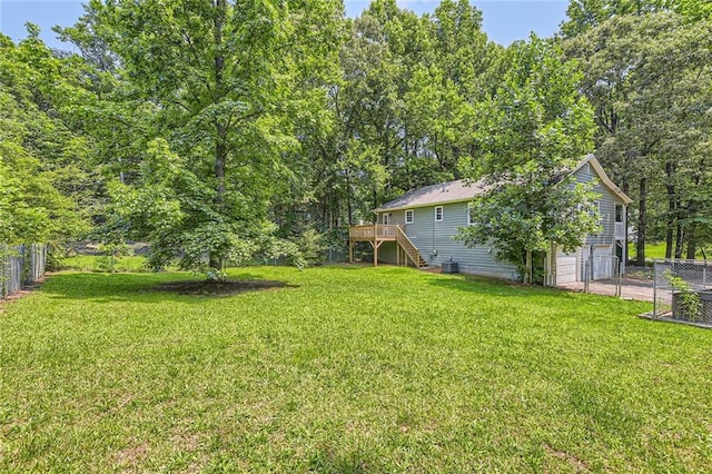62 Sweetwater Pkwy, Powder Springs, GA 30127 - view of yard with stairway, a wooden deck, an attached garage, and driveway