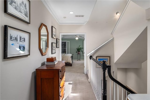 hall featuring recessed lighting, ornamental molding, visible vents, light carpet, and an upstairs landing