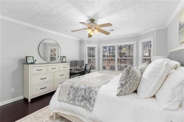 bedroom with a textured ceiling, dark wood-type flooring, and ornamental molding