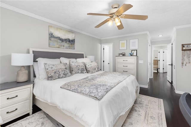 bedroom with ceiling fan, baseboards, dark wood finished floors, and crown molding