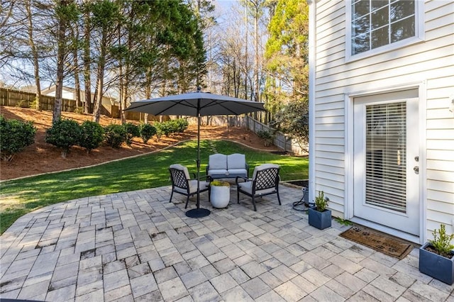 view of patio / terrace with stairway, outdoor lounge area, and fence