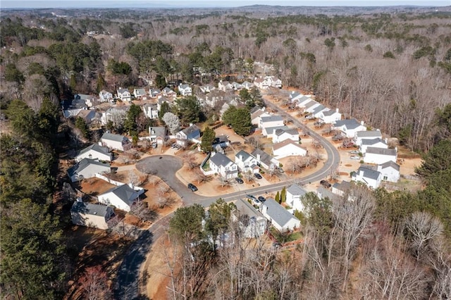 aerial view with a residential view and a view of trees