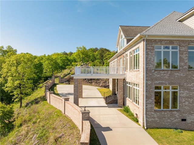 view of property exterior with a balcony