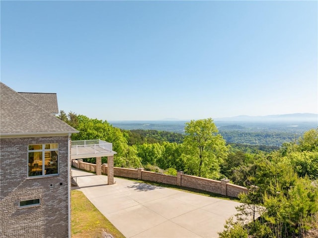 view of patio / terrace featuring a mountain view