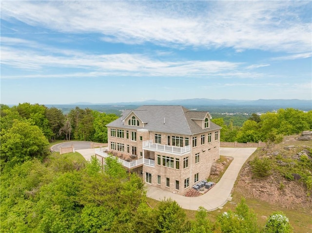 rear view of property with a balcony