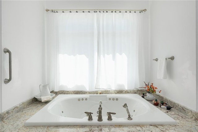 bathroom featuring a washtub