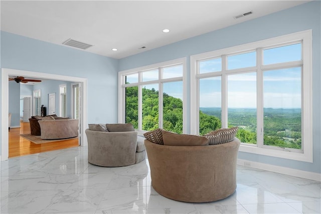 living room with ceiling fan