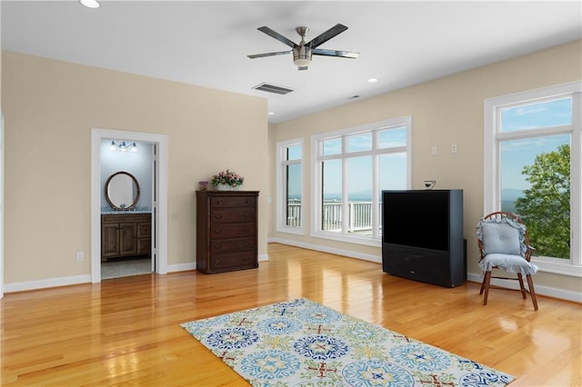 sitting room featuring ceiling fan and light hardwood / wood-style flooring