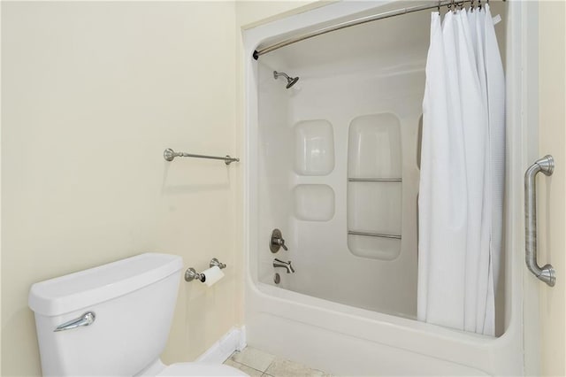 bathroom with shower / tub combo, tile patterned flooring, and toilet