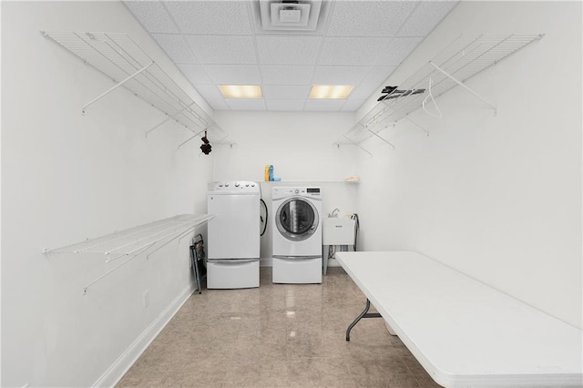 laundry room with sink and washer and clothes dryer