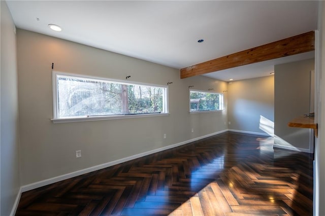 interior space featuring baseboards, beam ceiling, and recessed lighting