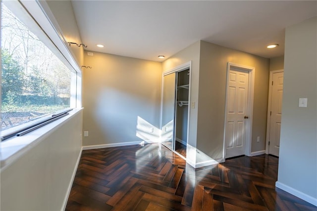 interior space with recessed lighting and baseboards