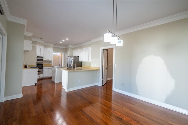 kitchen with a peninsula, baseboards, white cabinetry, and dark wood-style flooring