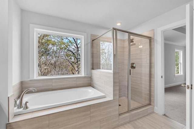 bathroom with separate shower and tub