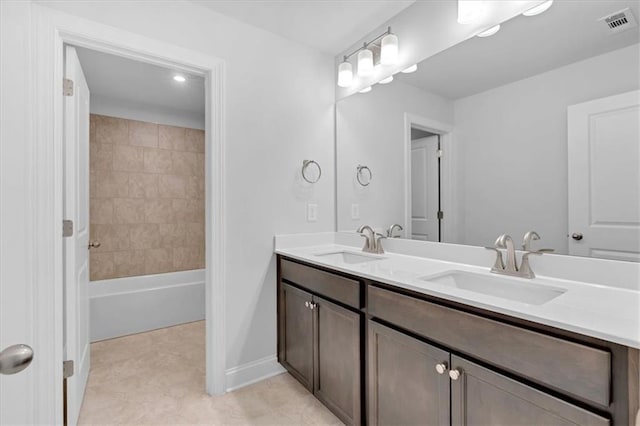 bathroom featuring vanity and shower / bathing tub combination