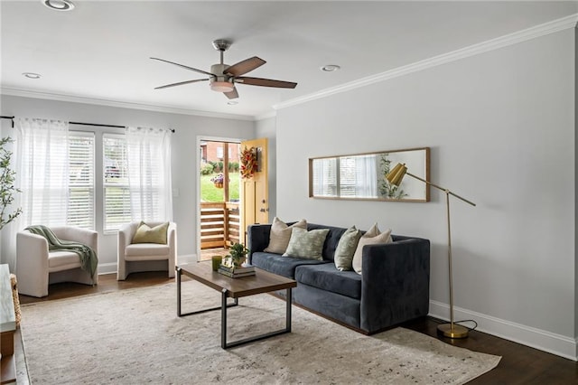 living area featuring baseboards, a ceiling fan, ornamental molding, wood finished floors, and recessed lighting