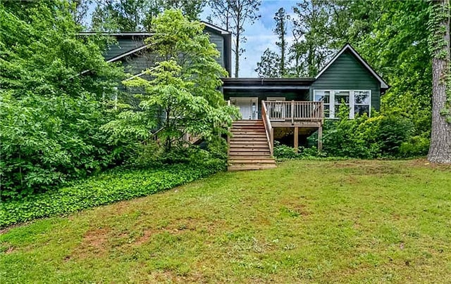 1033 Justice Ln NW, Acworth, GA 30102 - rear view of house with stairs, a yard, and a wooden deck