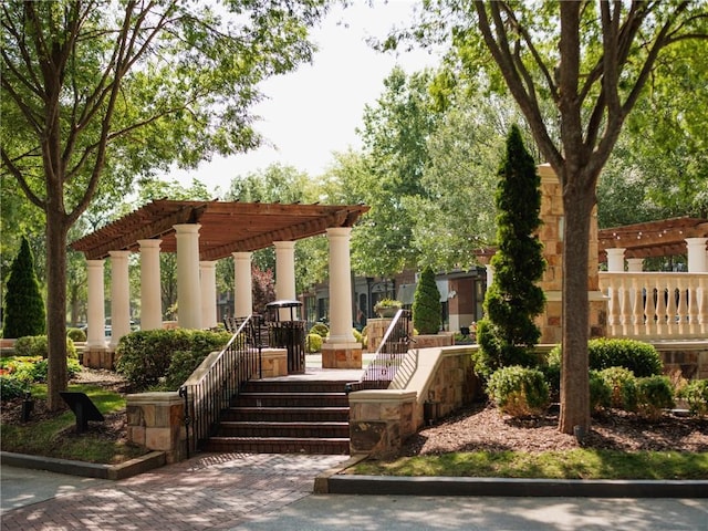 view of home's community featuring a pergola