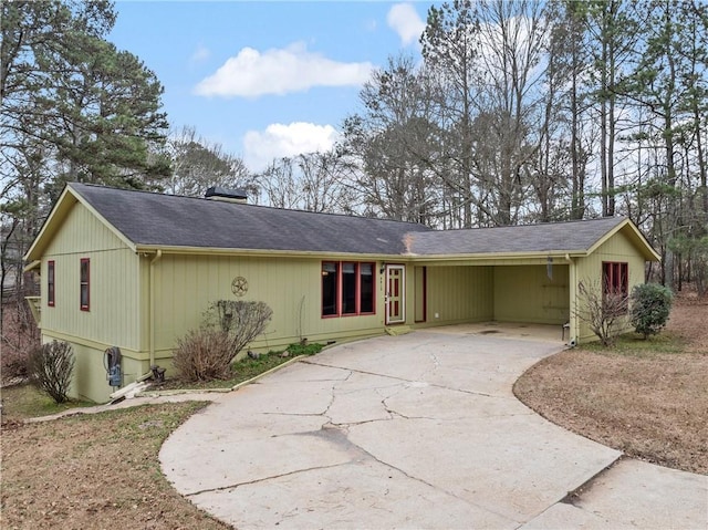 view of front of property featuring a carport