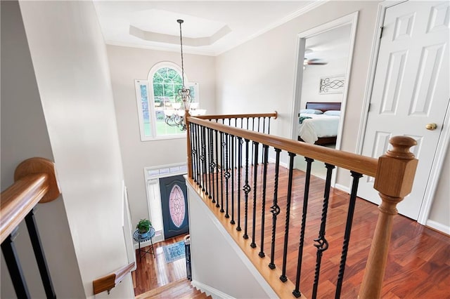 1558 Amberwood Creek Dr NW, Kennesaw, GA 30152 - stairway with a chandelier, wood finished floors, a raised ceiling, and ornamental molding