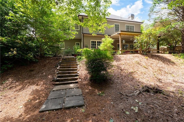 1558 Amberwood Creek Dr NW, Kennesaw, GA 30152 - rear view of house with stairs and a chimney