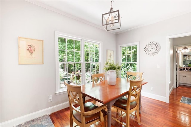 1558 Amberwood Creek Dr NW, Kennesaw, GA 30152 - dining space with plenty of natural light, light wood-style flooring, crown molding, and a chandelier