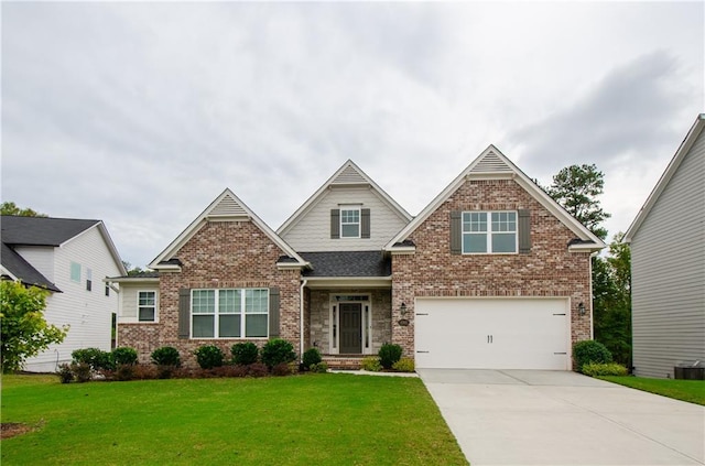 craftsman-style home featuring brick siding, a shingled roof, a front yard, a garage, and driveway