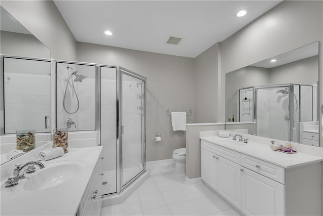 bathroom featuring walk in shower, toilet, and vanity