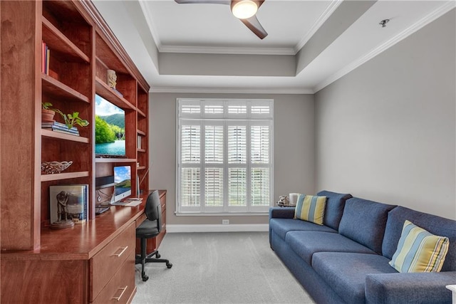 office featuring crown molding, a tray ceiling, ceiling fan, and carpet floors