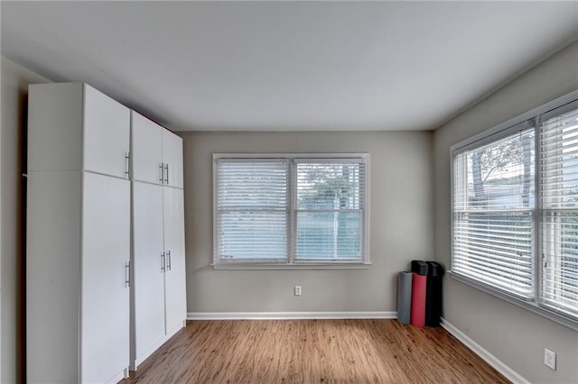 unfurnished bedroom featuring light wood-type flooring