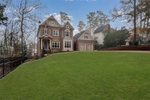 view of front of home with an outbuilding and a front yard